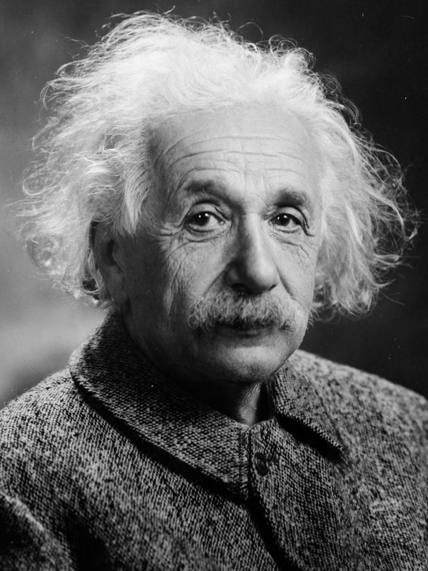 Black and white portrait of a famous scientist with a dark background. Albert Einstein
