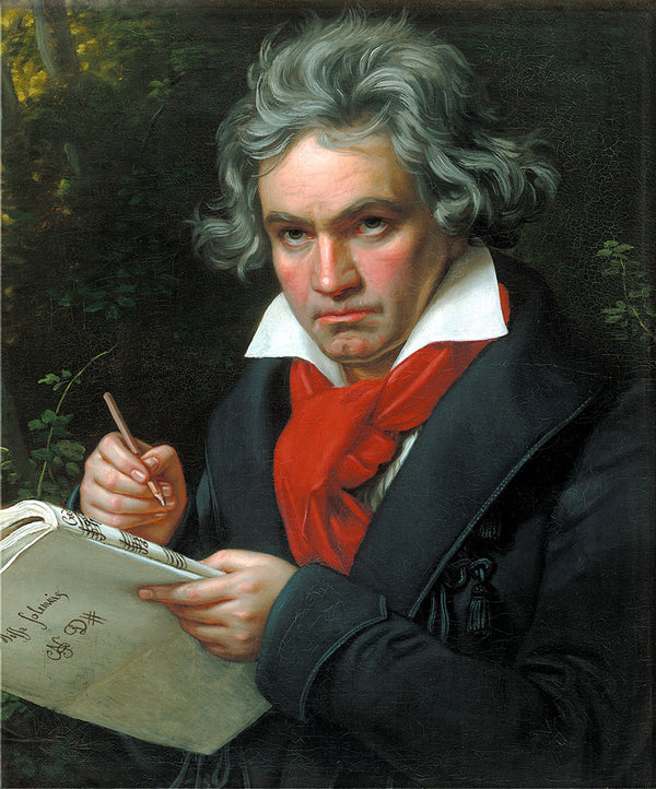 Portrait of a man with gray hair and a red scarf, holding a book and pen, against a dark background.