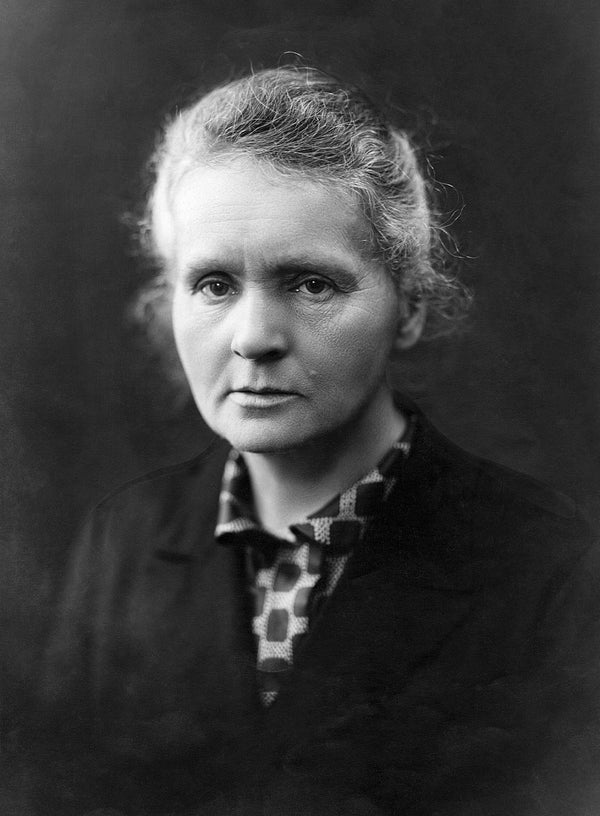Black and white portrait of a woman with a dark background