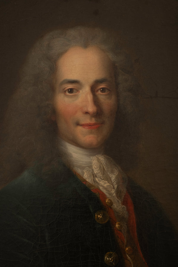Portrait of a man with powdered hair and formal attire against a dark background. Voltaire